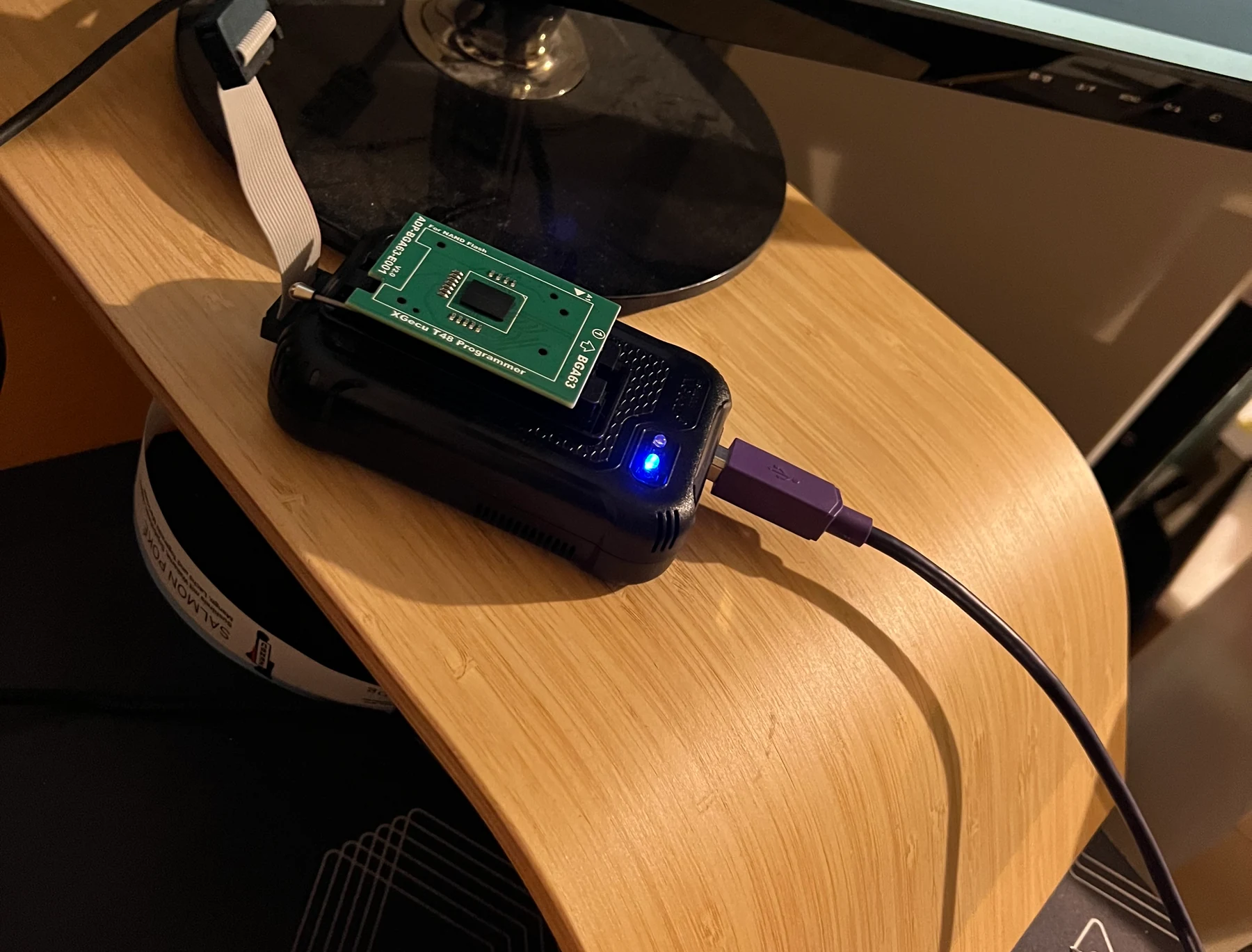 The reballed NAND mounted on its programmer adapter